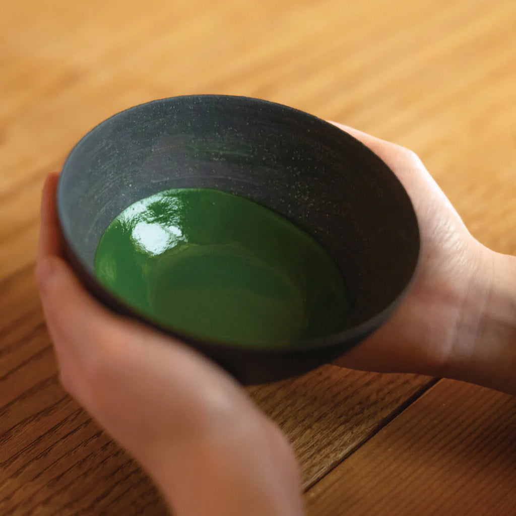 Ippodo Tea Kanza matcha tin with lid open showing fine premium green powder